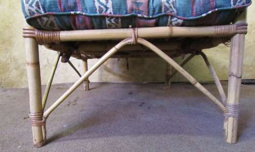 A FANTASTIC SINGLE SEATER CANE COUCH FOR THE PATIO