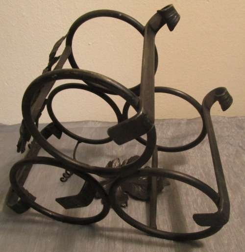 A lovely and large vintage wrought iron wine bottle holder, wine rack or bottle carrier for 3 bottel