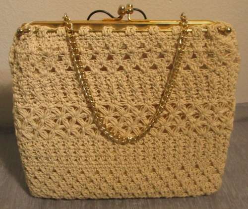 This is a beautiful vintage crochet box purse. It is a natural colored crochet box handbag