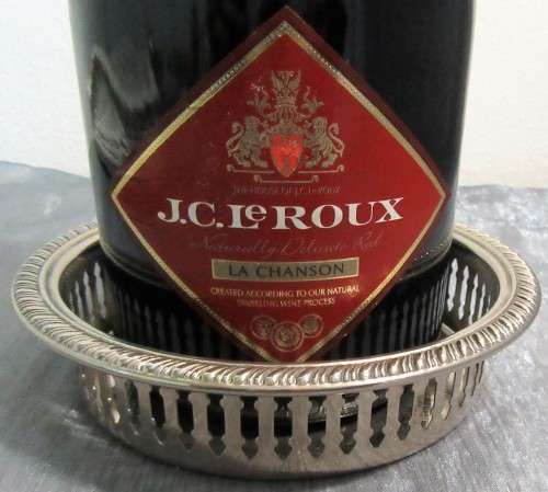 Two Vintage silver plated engraved, galleried champagne or wine bottle coaster