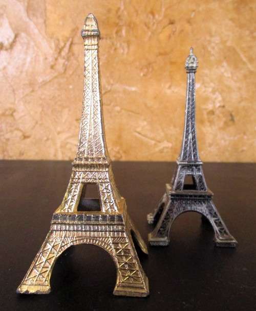 A nice pair of statues of the Eiffel Tower In Paris, originally made as visitor's souvenirs.  They l