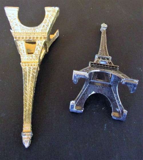 A nice pair of statues of the Eiffel Tower In Paris, originally made as visitor's souvenirs.  They l