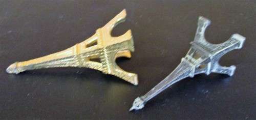A nice pair of statues of the Eiffel Tower In Paris, originally made as visitor's souvenirs.  They l