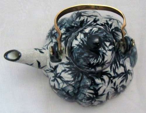 A BEAUTIFULLY DESIGNED TEA POT - HAND PAINTED IN THAILAND