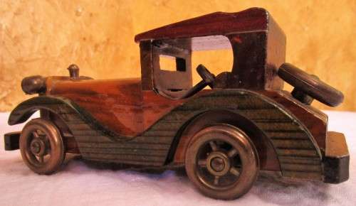 Vintage wooden hand made toy car, unpainted.