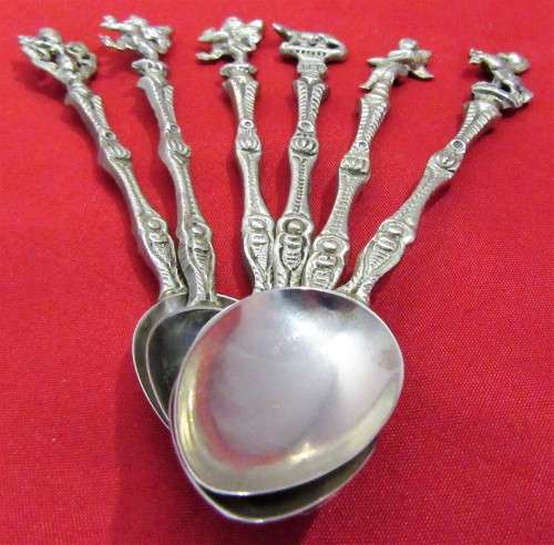 A VERY ORNATE SET OF 6 DESERT OR TEA SPOONS DECORATED WITH FIGURES & ANGELS VERY DIFFERENT