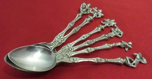A VERY ORNATE SET OF 6 DESERT OR TEA SPOONS DECORATED WITH FIGURES & ANGELS VERY DIFFERENT
