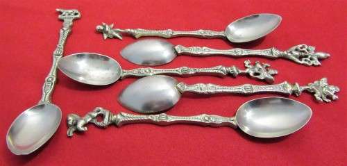 A VERY ORNATE SET OF 6 DESERT OR TEA SPOONS DECORATED WITH FIGURES & ANGELS VERY DIFFERENT