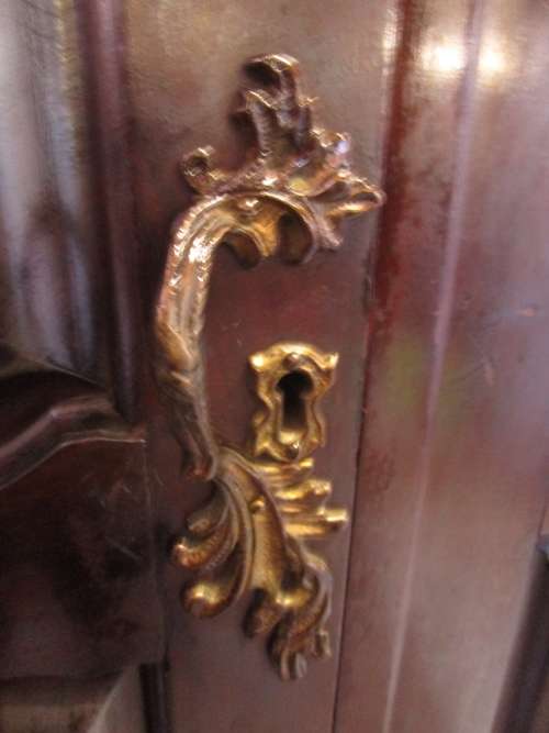 A VERY DIFFERENT IMBUIA 3 DOOR WARDROBE WITH ROUNDED SIDES AND BEAUTIFUL BRASS DETAIL