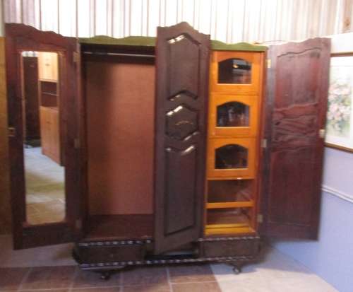 A VERY DIFFERENT IMBUIA 3 DOOR WARDROBE WITH ROUNDED SIDES AND BEAUTIFUL BRASS DETAIL