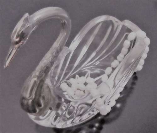 A vintage glass swan salt cellar or ring dish in good shape with a silver plated neck and head