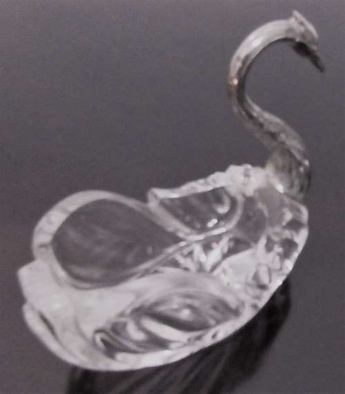 A vintage glass swan salt cellar or ring dish in good shape with a silver plated neck and head