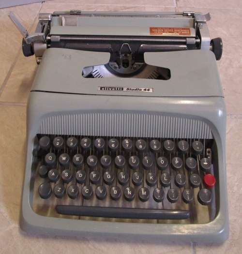 A MARVELOUS VINTAGE OLIVETTI STUDIO 44 TYPE WRITER MADE IN ITALY ASSEMBLED IN SOUTH AFRICA