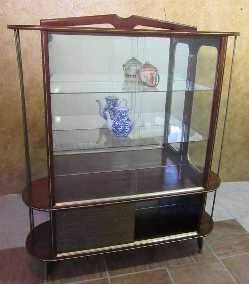 A VERY DIFFERENT IMBUIA BALL & CALW GLASS CABINET WITH A MIRROR AT THE BACK FINISHED OF WITH BRASS