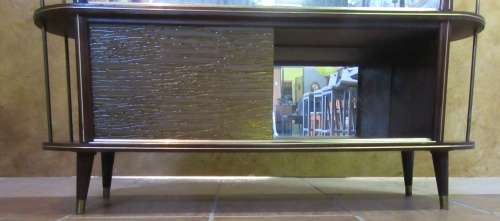 A VERY DIFFERENT IMBUIA BALL & CALW GLASS CABINET WITH A MIRROR AT THE BACK FINISHED OF WITH BRASS