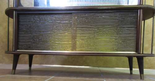 A VERY DIFFERENT IMBUIA BALL & CALW GLASS CABINET WITH A MIRROR AT THE BACK FINISHED OF WITH BRASS