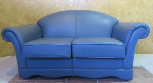 A ELEGANT 2 SEATER LEATHER? COUCH - IN GOOD CONDITION