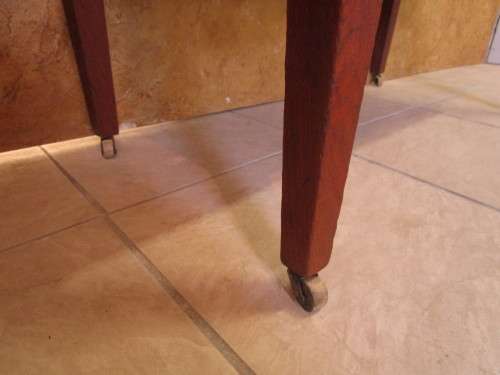 A GORGEOUS ANTIQUE MARBLE WASH STAND WITH THE ORIGINAL TILED BACK SPLASH RESTING ON ORIGINAL CASTERS