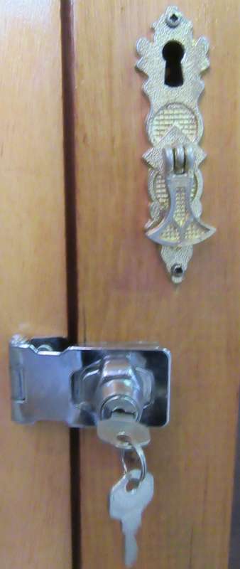 A STUNNING TWO DOOR SHOW/BOOK CASE FROM HEYSTECK RAND FURNITURE FACTORY A PRODUCT OF BOPHUTHATSWANA