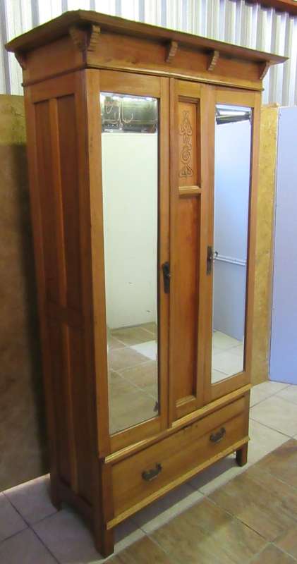 A GORGEOUS 1920'S ARTS AND CRAFTS WARDROBE WITH BEAUTIFUL CARFT DETAIL