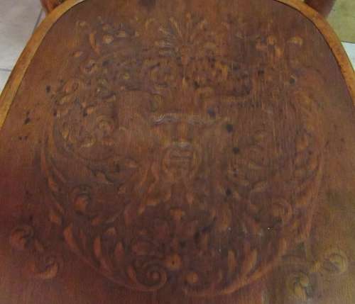 A STUNNING ANTIQUE GLOBE CHAIR WITH DETAIL ON THE SEAT AND BACK