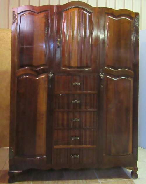 A stunning Three door solid Imbuia wardrobe with solid brass embellishments & ample space