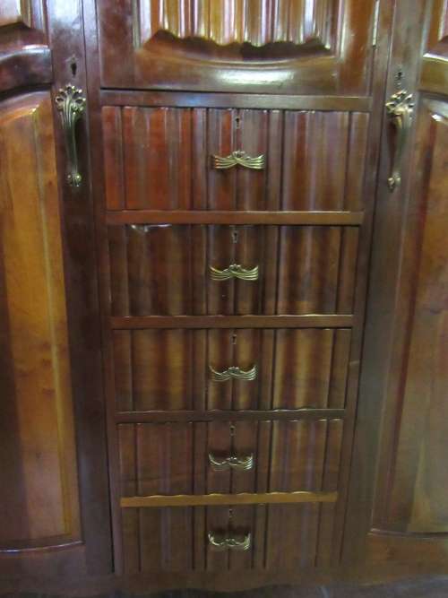 A stunning Three door solid Imbuia wardrobe with solid brass embellishments & ample space