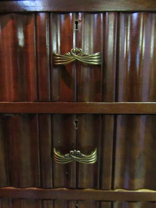 A stunning Three door solid Imbuia wardrobe with solid brass embellishments & ample space