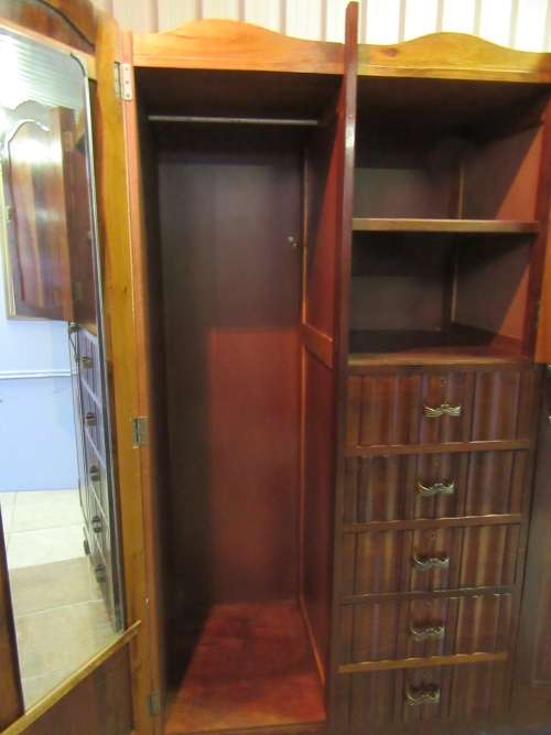 A stunning Three door solid Imbuia wardrobe with solid brass embellishments & ample space