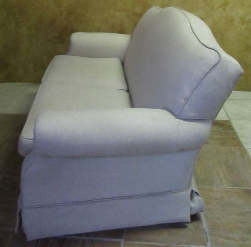 A VERY COMFORTABLE 2 SEATER COUCH IN GOOD CONDITTION