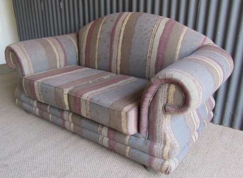 A VERY COMFORTABLE 2 SEATER SOFA FABRIC IS FAIR ONE OR TWO SCUFS - OR FOR RECOVERY