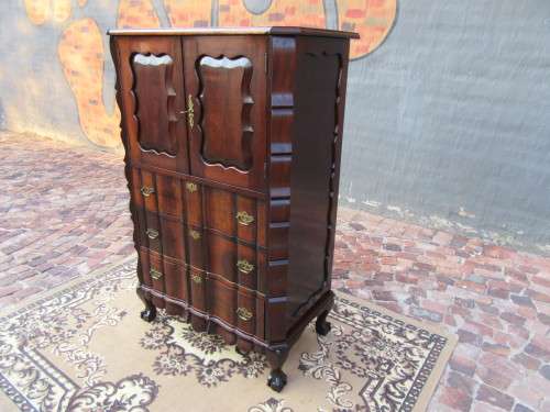 A beautiful Stinkwood ball and claw `Tallboy` multi-purpose cabinet with 3 drawers