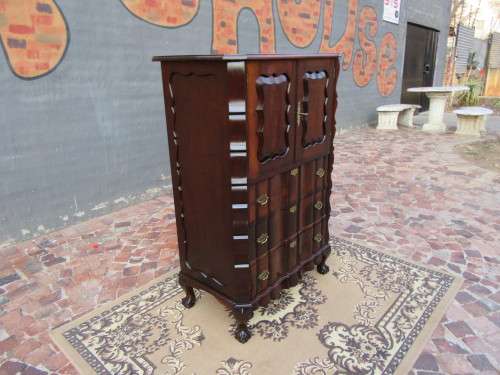 A beautiful Stinkwood ball and claw `Tallboy` multi-purpose cabinet with 3 drawers