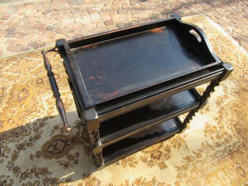 Three-tier tea trolley with barley twist legs and serving tray with a top glass top.