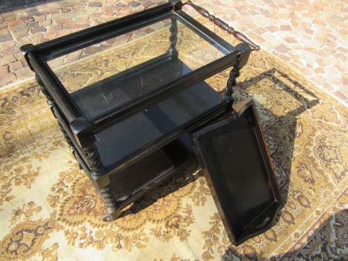 Three-tier tea trolley with barley twist legs and serving tray with a top glass top.
