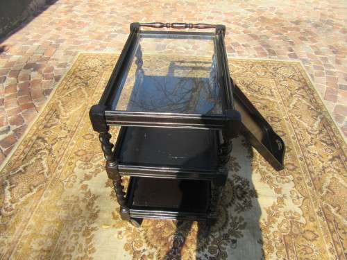 Three-tier tea trolley with barley twist legs and serving tray with a top glass top.