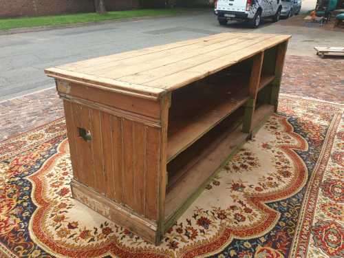 Large Oregan Antique shop counter with shelves at the back