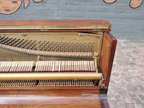 Danemann upright piano in teak cabinetry is a brilliant upright piano