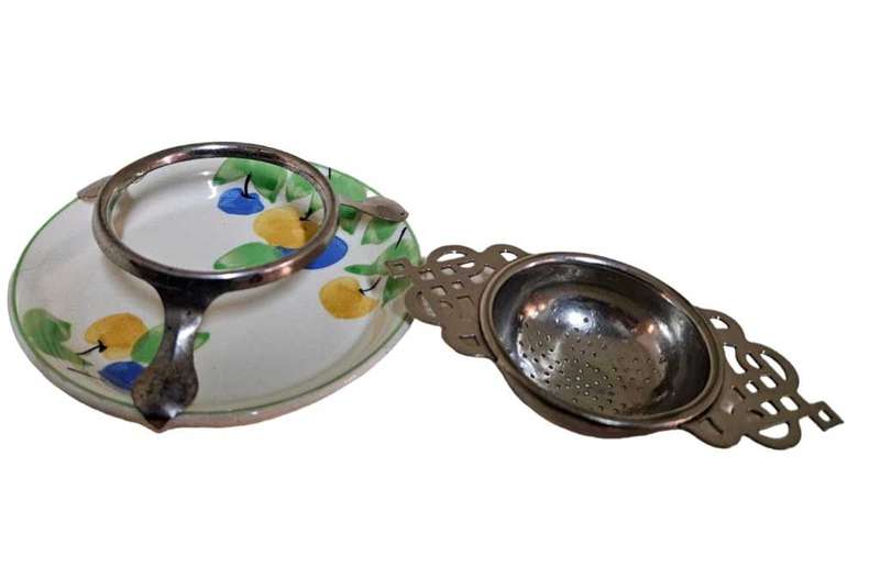Antique strainer Aursim Ware