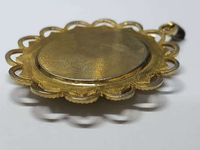 Forget me not pendant with a gold tone