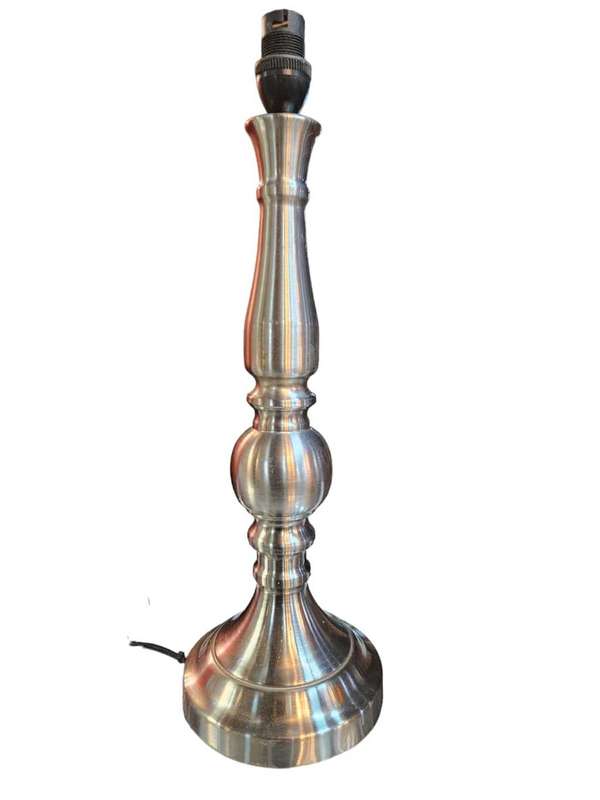 Add a touch of elegance to any space with this stunning Pillar Silver Metal Table Lamp.