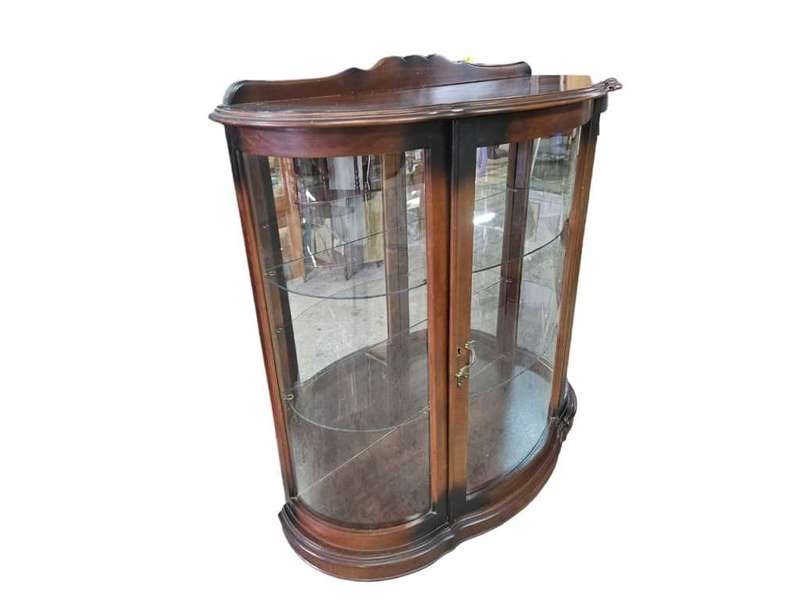 Immerse yourself in the timeless elegance of our Imbuia display cabinet, a sophisticated piece