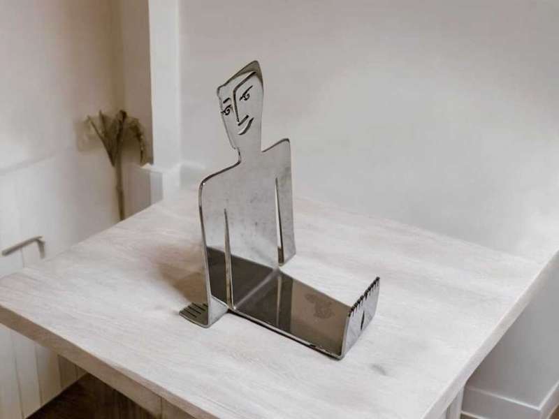 Carrol Boyes Face Off business card holder stand, a sleek and modern