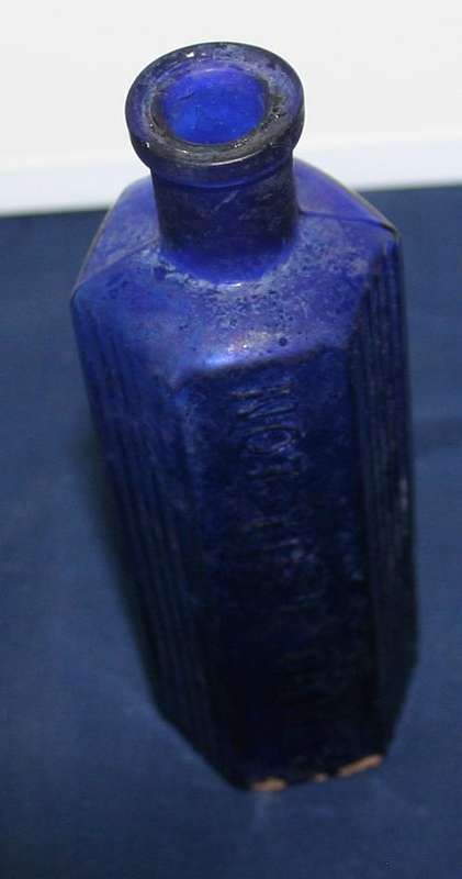 BEAUTIFUL ANTIQUE BLUE GLASS BOTTEL EMBOSSED WITH NOT TO BE TAKEN