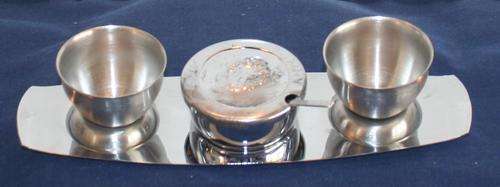 EXQUISITE  VINTAGE FOUR PIECE S STEEL SET WITH TO CUPS,  SALT POT AND SPOON DISPLAYED ON A TRAY
