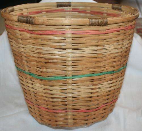 AN BEAUTIFUL WOVEN BASKET/DUST BIN