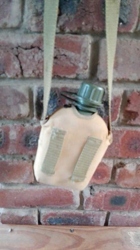 ARMY WATER BOTTLE WITH WEBBING STRAP AND WEB BELT LOOPS  (  see photographs )