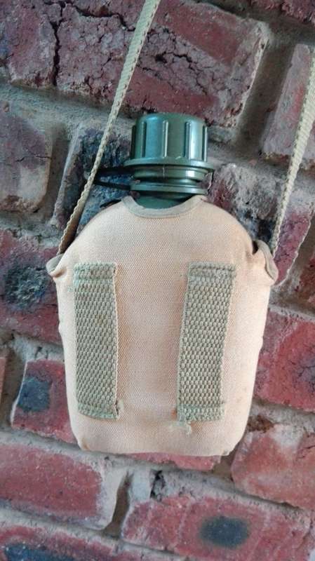 ARMY WATER BOTTLE WITH WEBBING STRAP AND WEB BELT LOOPS  (  see photographs )