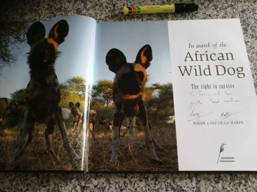 Signed by both Authors IN SEARCH OF THE AFRICAN WILD DOG ROGER and PAT DE LA HARPE  signed