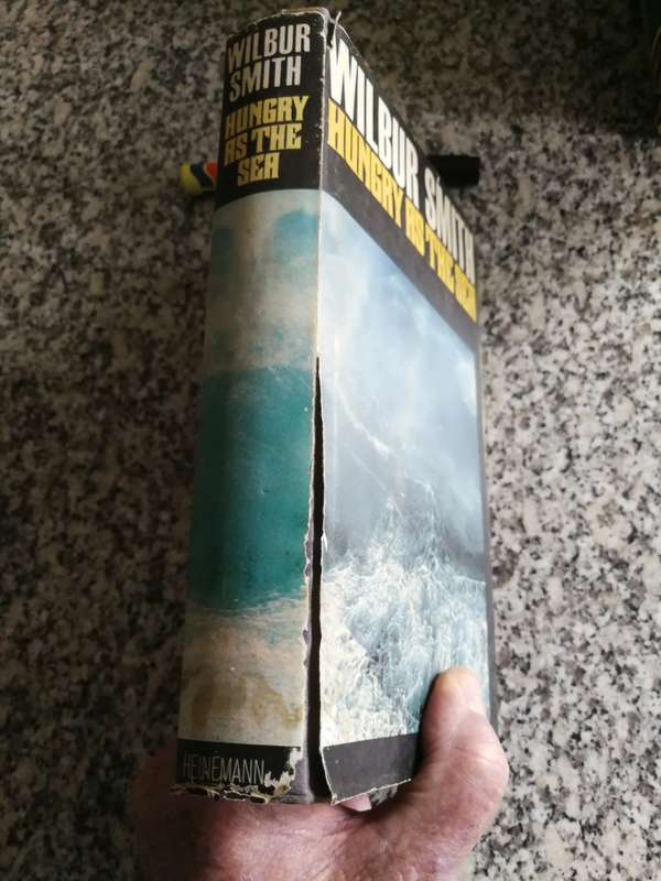 WILBUR SMITH HUNGRY AS THE SEA HEINEMAN 1978 Reprint  Edition